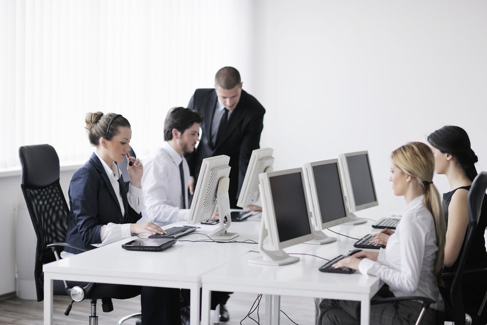 business people group with  headphones giving support in  help desk office to customers, manager giving training and education instructions